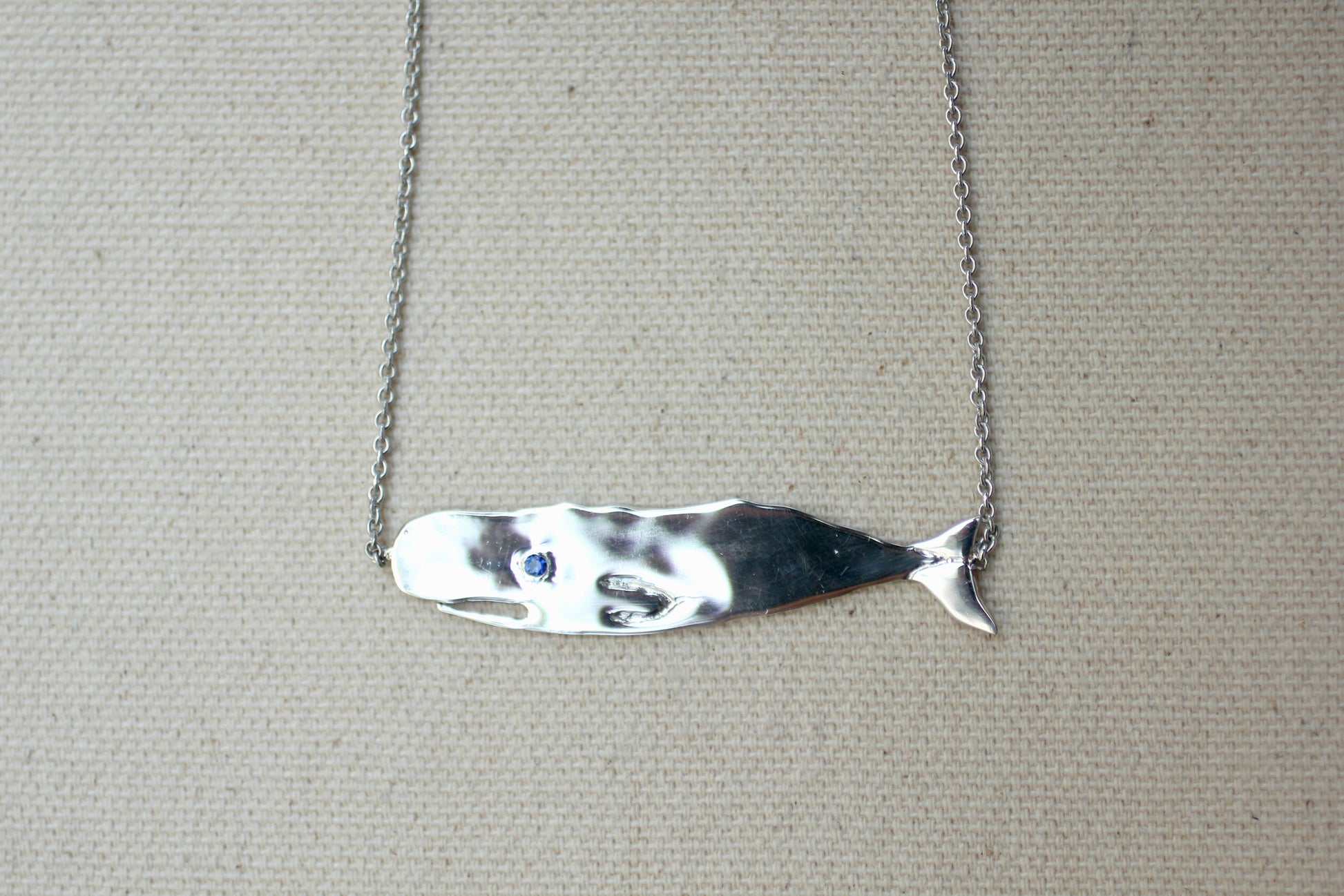 Sapphire and Sterling Silver Hand-Carved Flat Whale Necklace handmade by Jewel in the Sea Nantucket