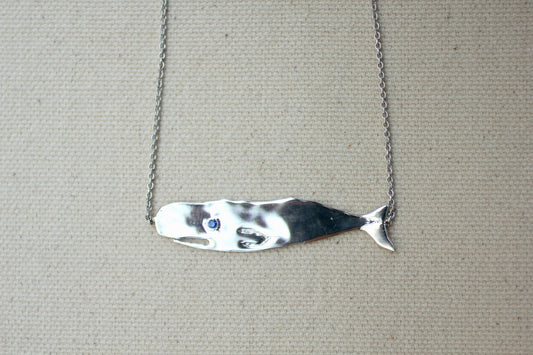 Sapphire and Sterling Silver Hand-Carved Flat Whale Necklace handmade by Jewel in the Sea Nantucket
