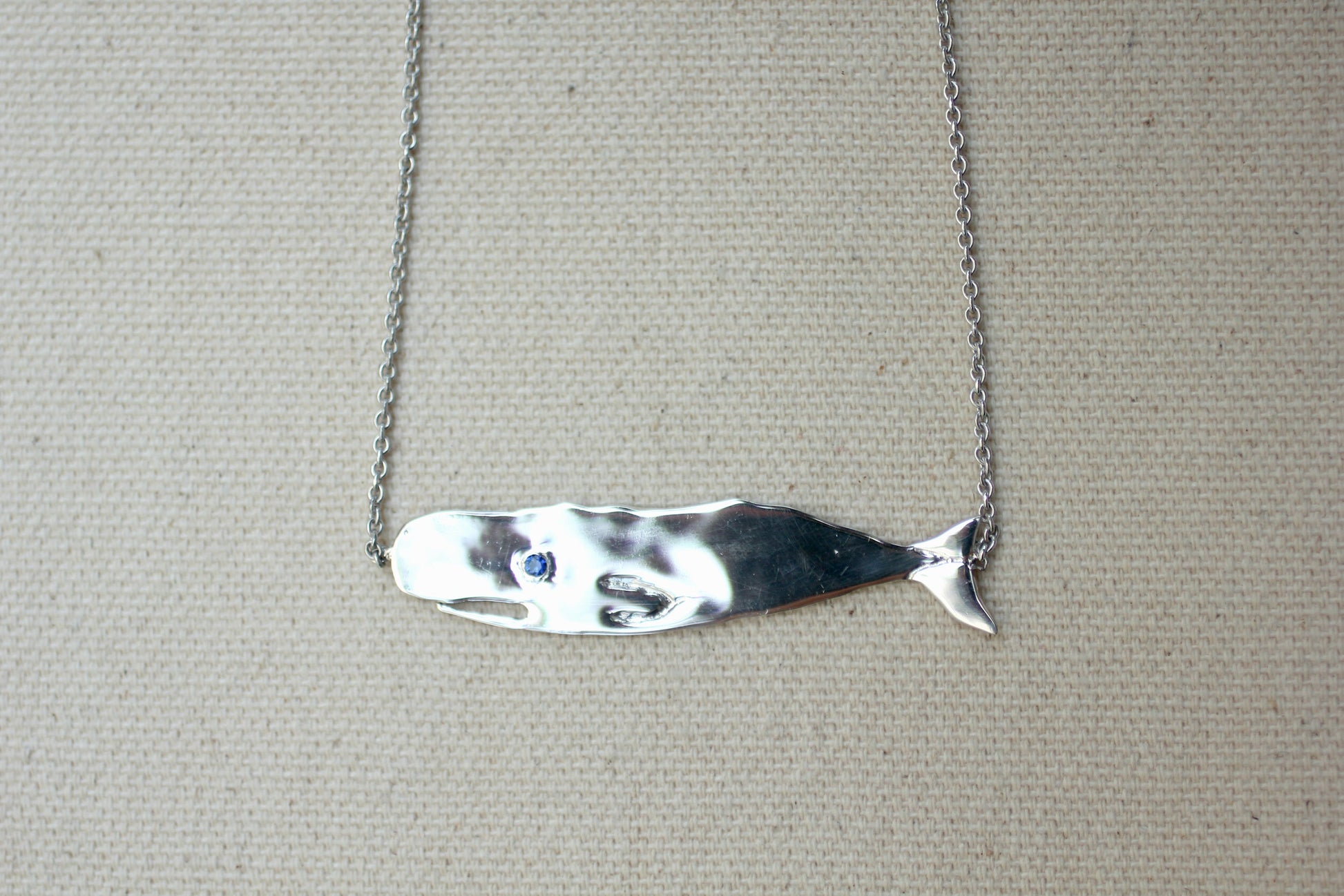 Sapphire and Sterling Silver Hand-Carved Flat Whale Necklace handmade by Jewel in the Sea Nantucket 