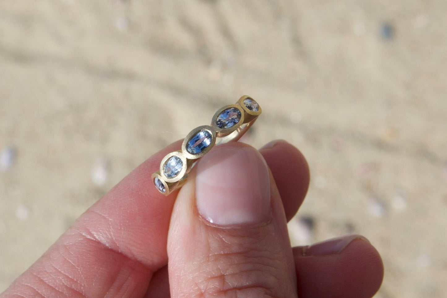 Light Sapphire 5-Stone Ring, bezel-set and featuring a 14K Yellow Gold satin finish handmade by Jewel in the Sea Nantucket